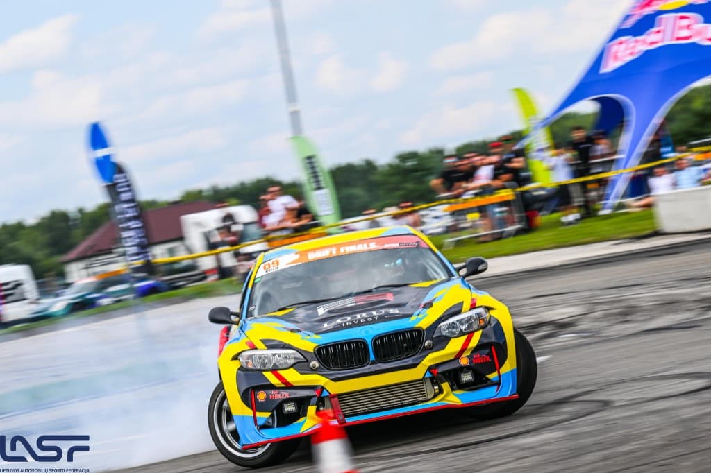 Yellow BMW drift car in action on the circuit
