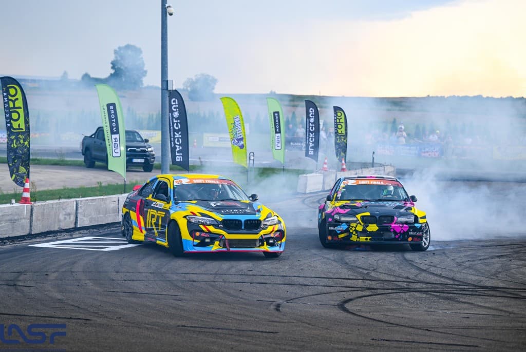 Two drift cars in tandem on the track